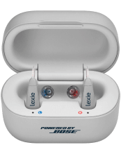 A pair of gray Lexie B2 Powered by Bose hearing aids, inside of a gray case.